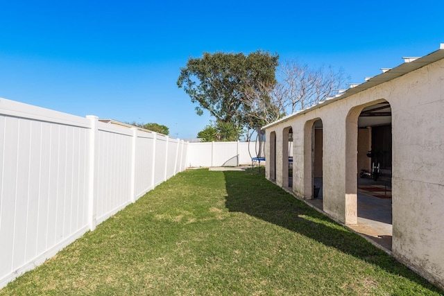 view of yard with a fenced backyard