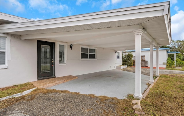 5813 18th Ave S, Gulfport, FL 33707 - view of patio / terrace with a carport