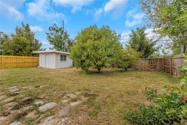 5813 18th Ave S, Gulfport, FL 33707 - view of yard featuring an outdoor structure and a fenced backyard