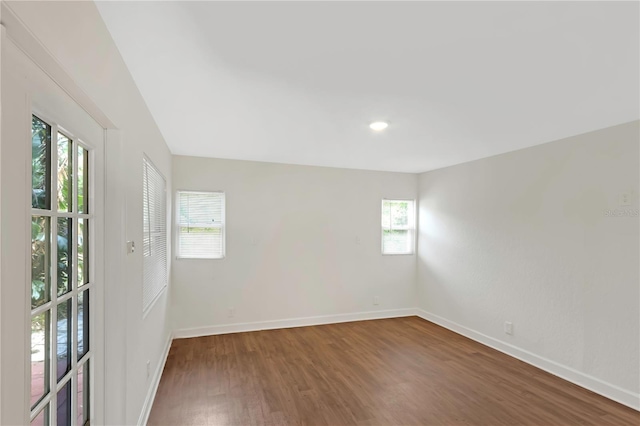 5813 18th Ave S, Gulfport, FL 33707 - spare room with baseboards and wood finished floors