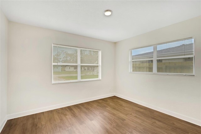 5813 18th Ave S, Gulfport, FL 33707 - spare room with wood finished floors and baseboards