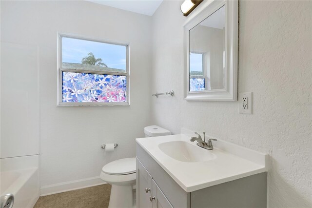 5813 18th Ave S, Gulfport, FL 33707 - full bathroom with baseboards, plenty of natural light, toilet, and vanity