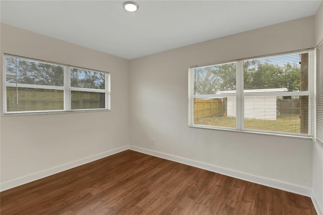 5813 18th Ave S, Gulfport, FL 33707 - unfurnished room with dark wood-style floors and baseboards