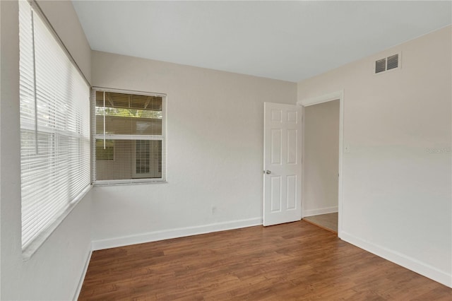 5813 18th Ave S, Gulfport, FL 33707 - unfurnished room with visible vents, baseboards, and wood finished floors