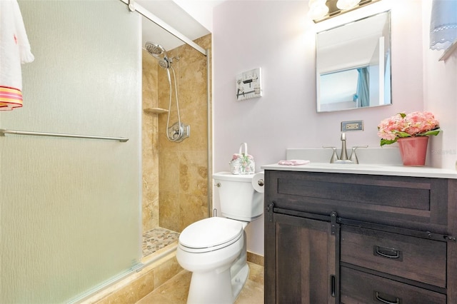 full bathroom with a shower stall, toilet, and vanity