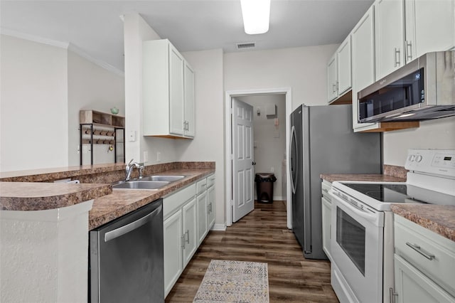 kitchen with visible vents, appliances with stainless steel finishes, dark wood-style flooring, white cabinetry, and a sink