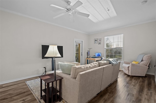 living room with baseboards, ornamental molding, ceiling fan, and dark wood-style flooring