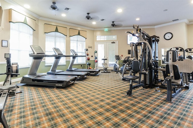 gym featuring ornamental molding, a wealth of natural light, carpet, and visible vents