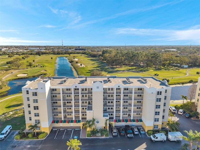 aerial view with view of golf course and a water view