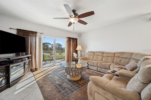 living area with light tile patterned floors and a ceiling fan