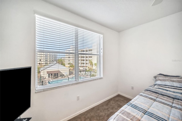 bedroom with carpet and baseboards