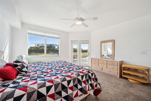 carpeted bedroom with access to outside and a ceiling fan