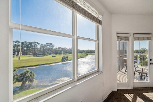 unfurnished sunroom with a water view