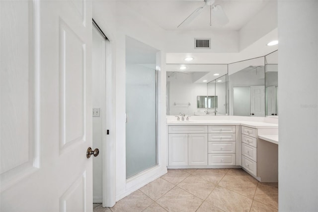 bathroom with visible vents, ceiling fan, a shower stall, vanity, and tile patterned floors