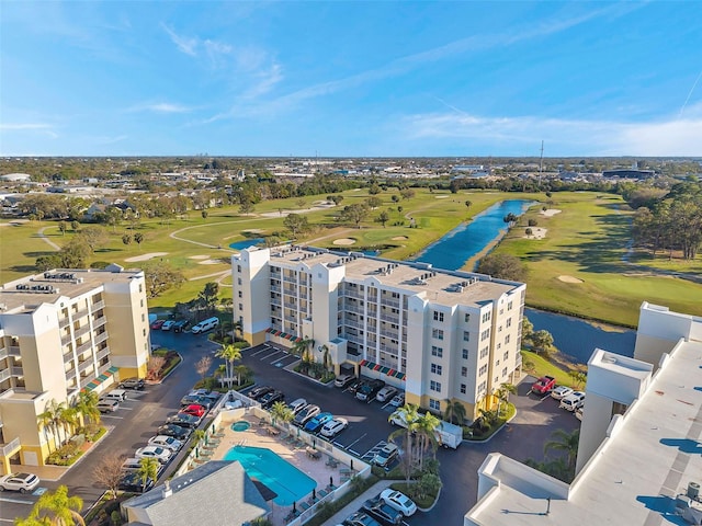 bird's eye view featuring view of golf course and a water view