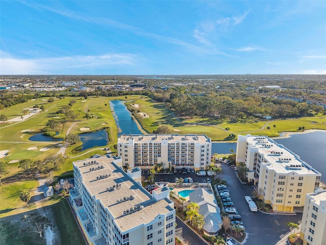 bird's eye view featuring a water view and golf course view