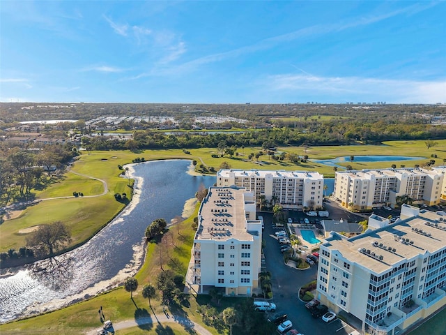 bird's eye view with view of golf course and a water view