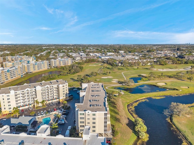 bird's eye view featuring a view of city, view of golf course, and a water view