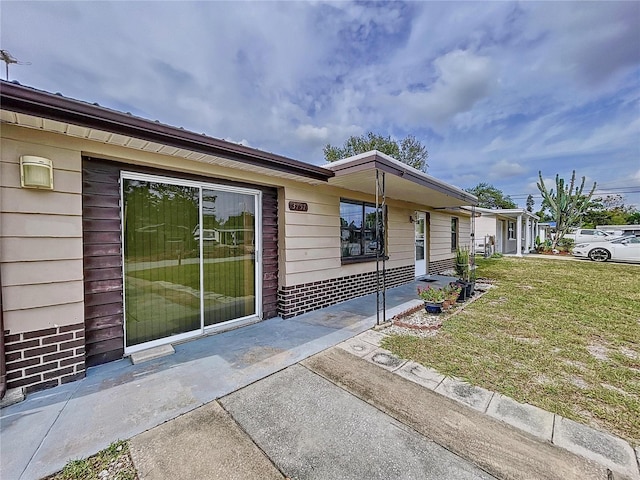 exterior space featuring a yard