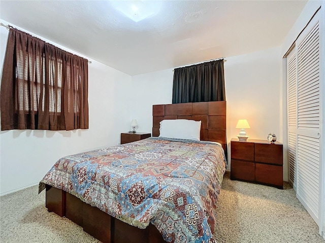 bedroom with baseboards and carpet flooring