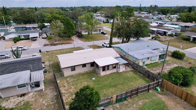 birds eye view of property with a residential view