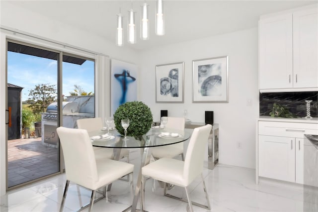 dining space with marble finish floor