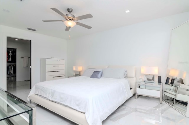 bedroom with a ceiling fan, marble finish floor, and visible vents