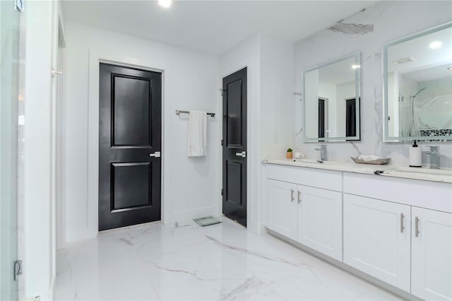 full bathroom featuring recessed lighting, marble finish floor, vanity, and a marble finish shower