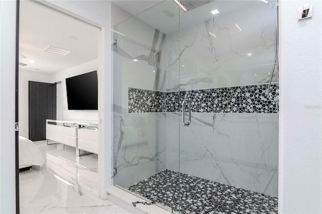 full bathroom featuring marble finish floor and a marble finish shower