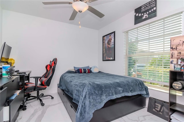 bedroom with a ceiling fan and marble finish floor