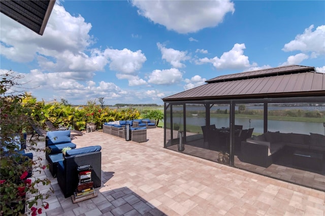 view of patio / terrace with a water view and an outdoor hangout area