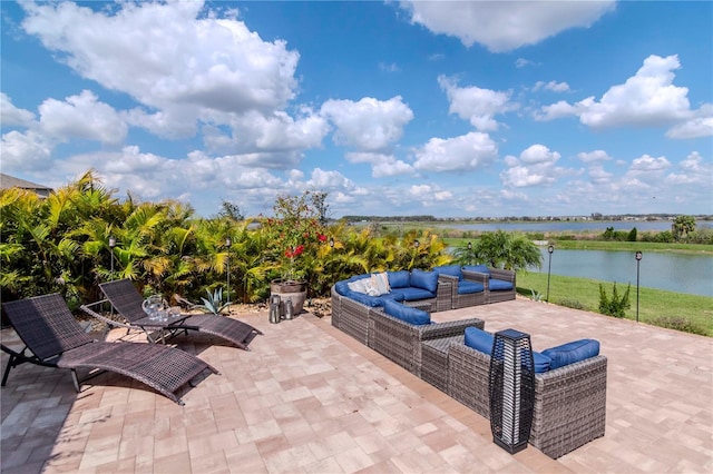 view of patio with a water view and an outdoor hangout area