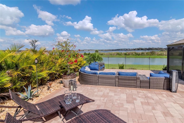 view of patio / terrace featuring a water view and outdoor lounge area