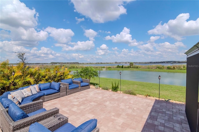 view of patio / terrace featuring an outdoor hangout area and a water view