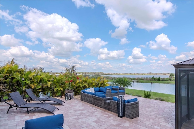 view of patio featuring a water view and an outdoor living space