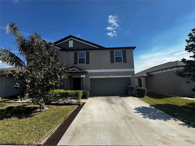 traditional home with a front lawn, concrete driveway, an attached garage, and stucco siding