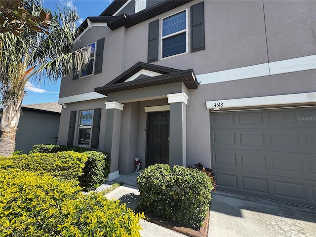 property entrance featuring stucco siding