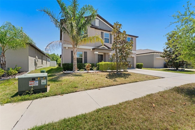 craftsman-style home featuring stucco siding, a front lawn, and concrete driveway