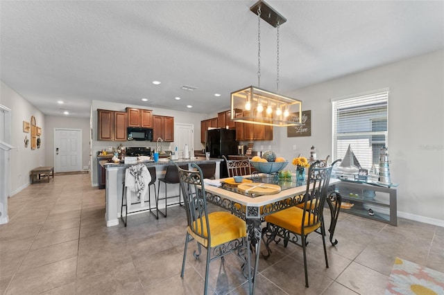 dining room featuring recessed lighting, visible vents, light tile patterned floors, baseboards, and a textured ceiling