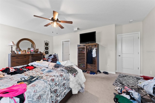 bedroom with visible vents, baseboards, a closet, ceiling fan, and carpet floors