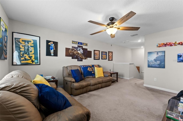 carpeted living room featuring baseboards, a ceiling fan, and visible vents