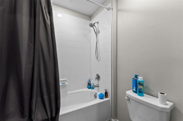 full bathroom featuring shower / tub combo and toilet