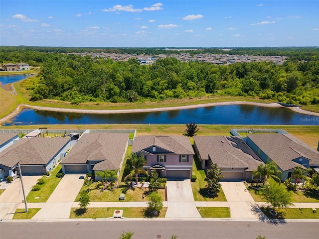 birds eye view of property with a residential view and a water view