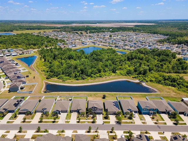 drone / aerial view featuring a residential view and a water view