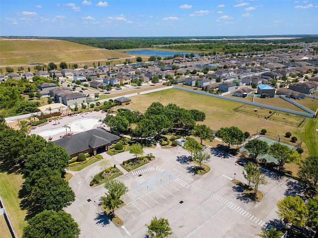 bird's eye view with a residential view and a water view