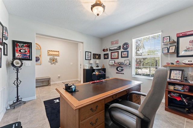 14618 Scottburgh Glen Dr, Wimauma, FL 33598 - office area featuring light tile patterned floors, baseboards, and a textured ceiling