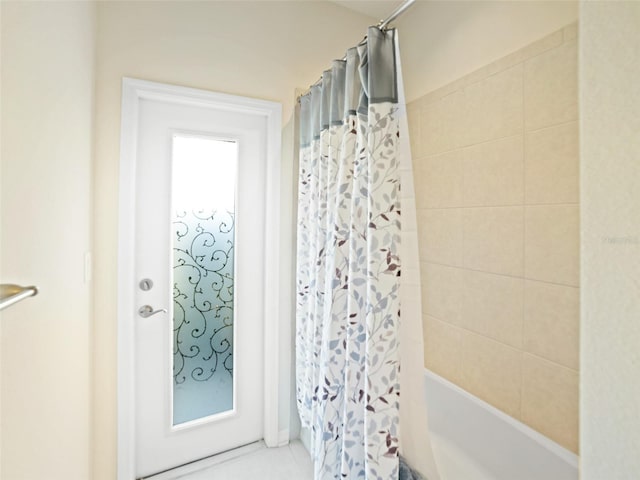 full bathroom with shower / bath combo with shower curtain