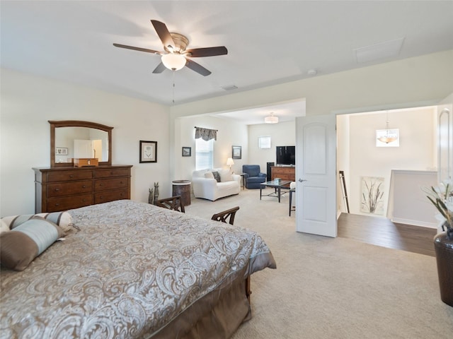 bedroom featuring carpet floors, visible vents, and a ceiling fan