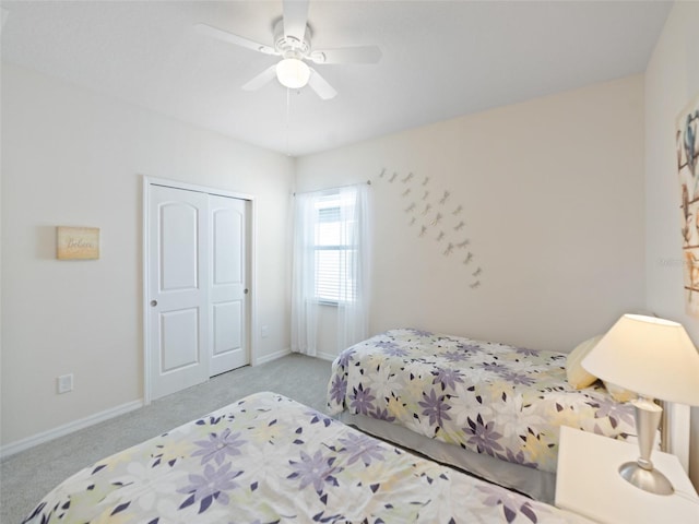 carpeted bedroom featuring ceiling fan and baseboards