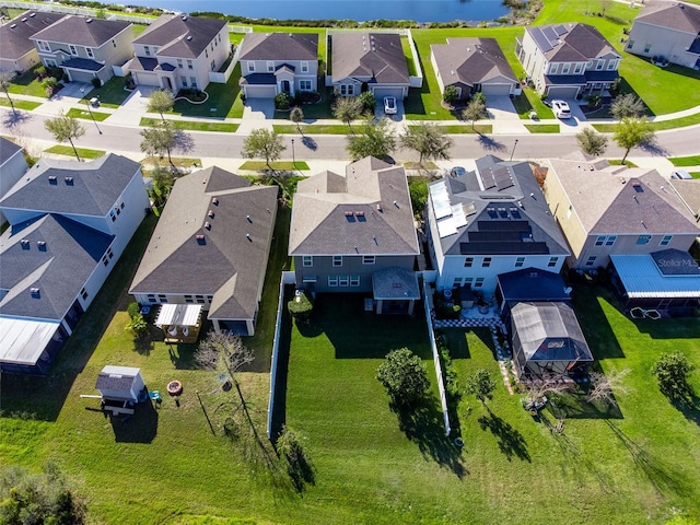 birds eye view of property with a residential view